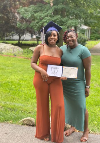 A woman and her mother holding a diploma